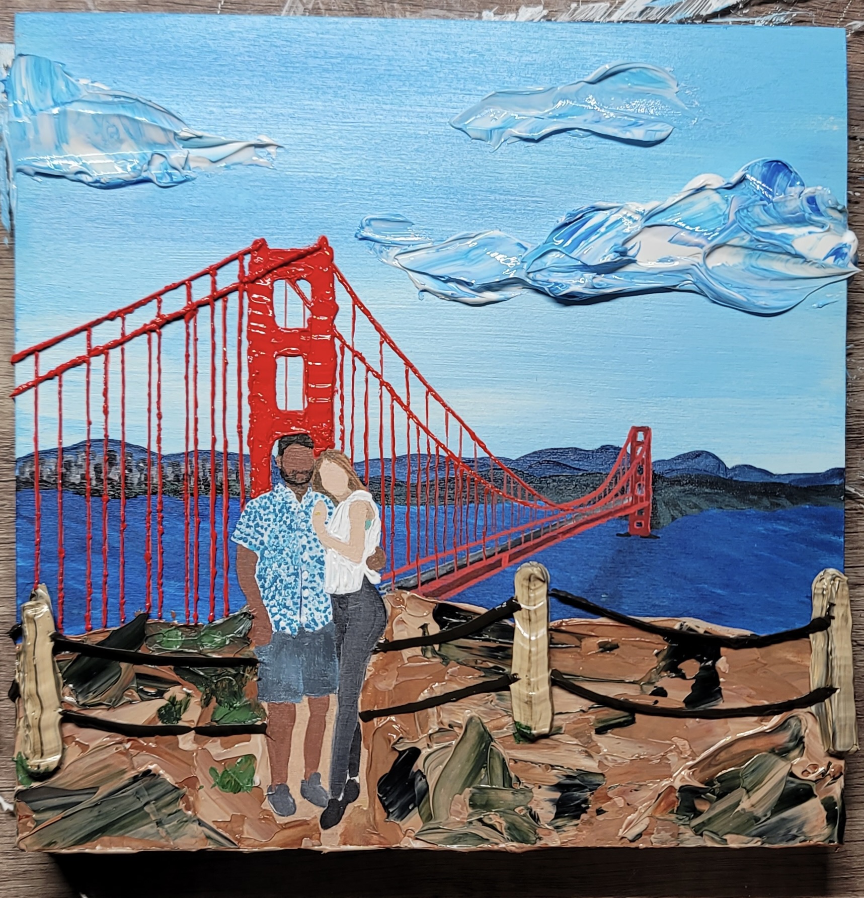 Painting of 2 people in front of the San Franciso Bridge